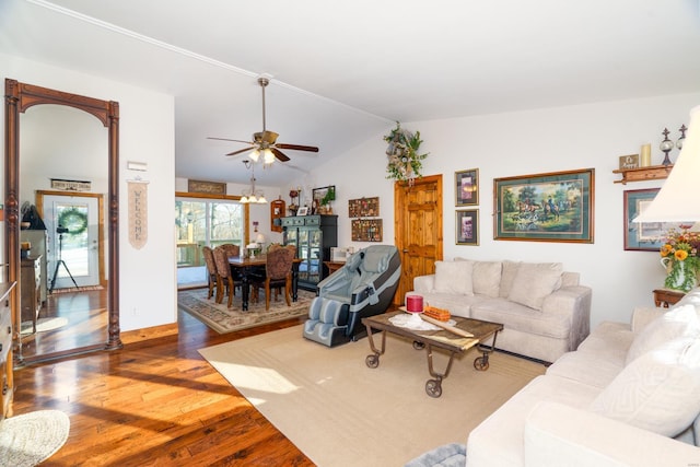 living room featuring wood-type flooring, ceiling fan, and lofted ceiling