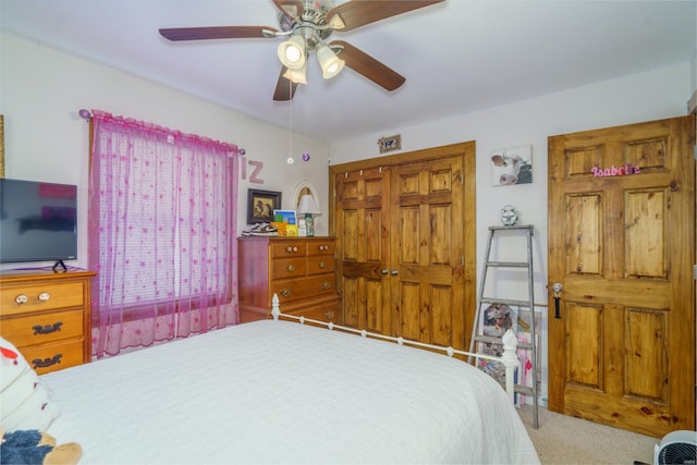 bedroom with carpet, a closet, and ceiling fan