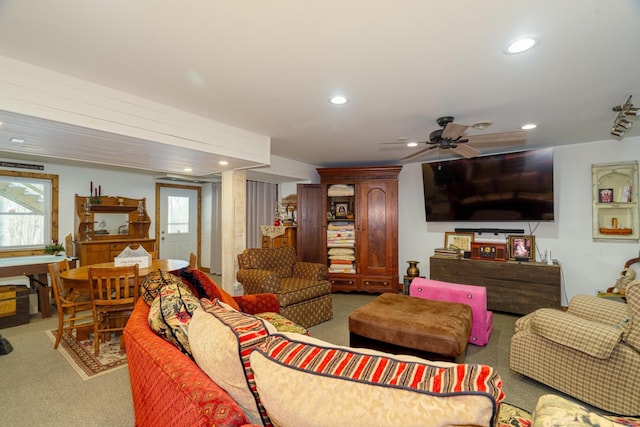 carpeted living room featuring ceiling fan