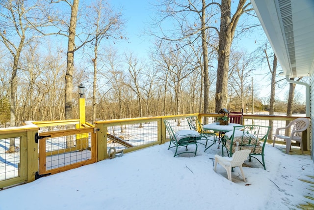 view of snow covered deck