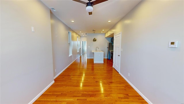 hallway featuring light wood-type flooring