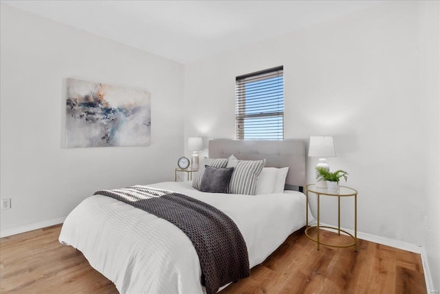 bedroom featuring wood-type flooring