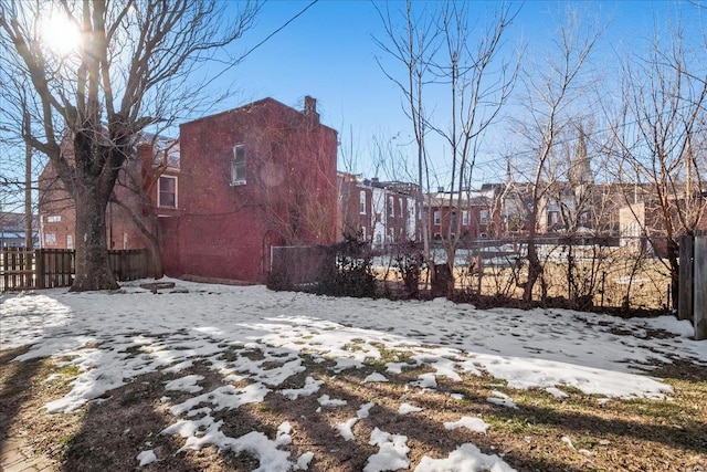 view of yard covered in snow