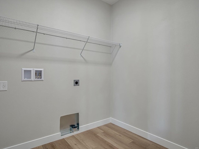 laundry area featuring hardwood / wood-style floors, hookup for a washing machine, and hookup for an electric dryer