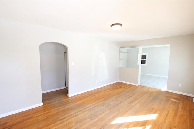 spare room with light hardwood / wood-style floors