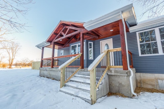 view of snow covered property entrance