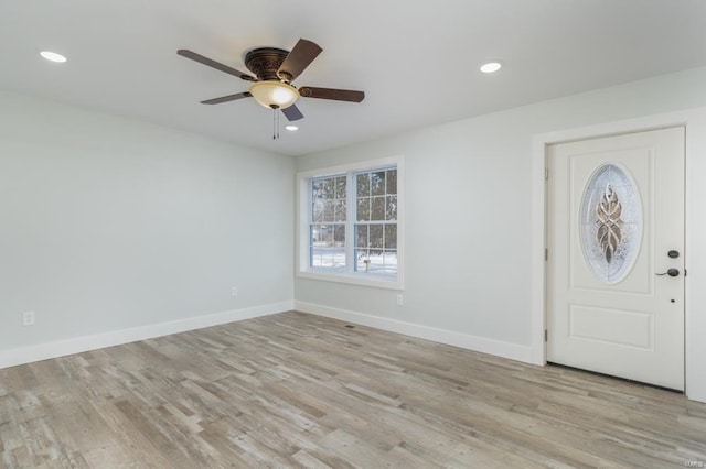 entryway with light hardwood / wood-style floors and ceiling fan