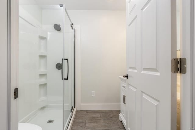 bathroom featuring a shower with shower door