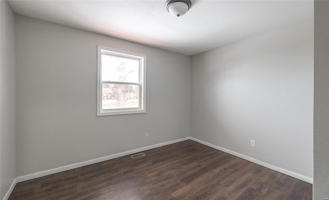 empty room featuring dark hardwood / wood-style floors