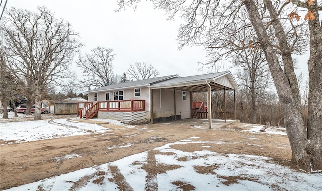 view of front of property featuring a wooden deck