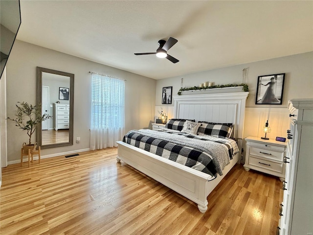 bedroom featuring light hardwood / wood-style flooring and ceiling fan