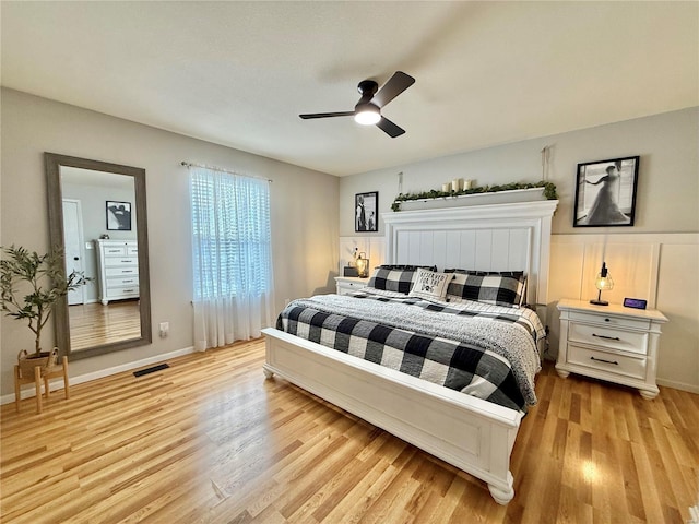 bedroom with light hardwood / wood-style flooring and ceiling fan