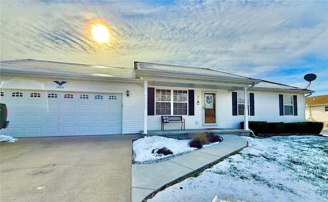 single story home featuring a garage and a porch