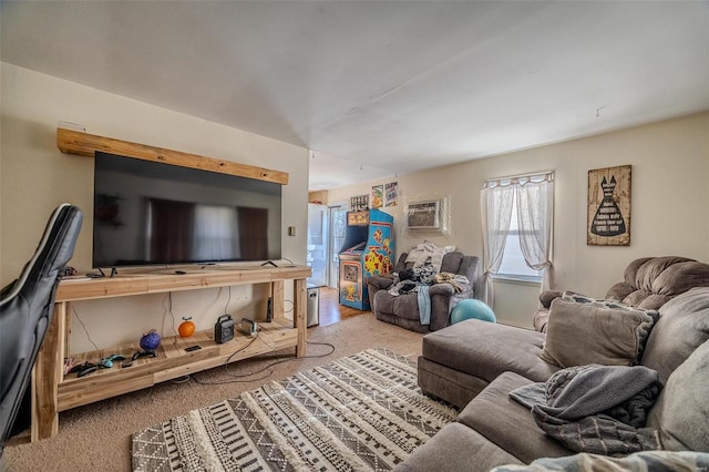 carpeted living room featuring a wall unit AC