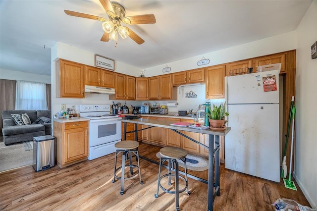 kitchen with ceiling fan, white appliances, and light wood-type flooring