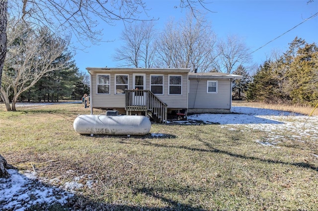 rear view of house with a lawn