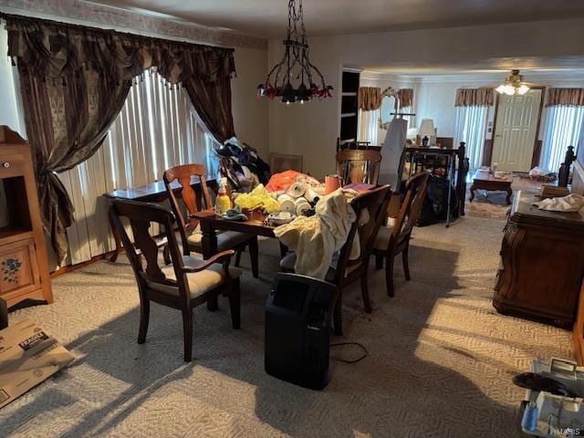 dining room featuring light carpet