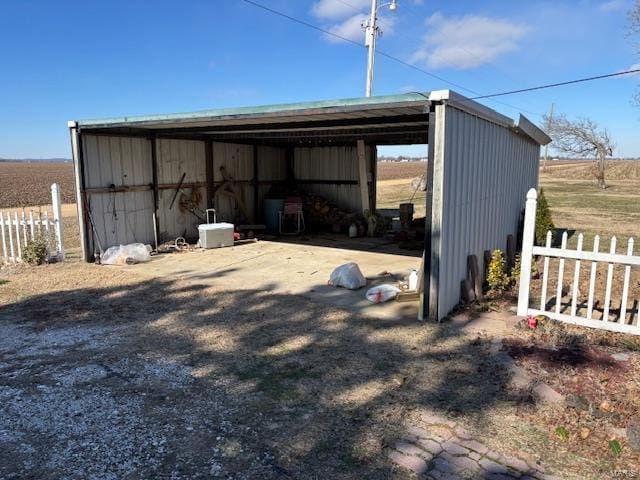 view of outbuilding with a rural view