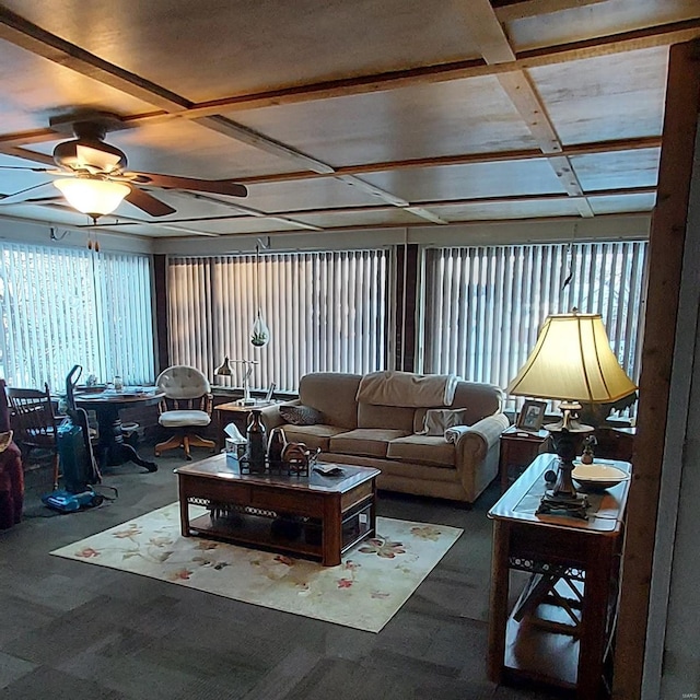 carpeted living room with ceiling fan and coffered ceiling