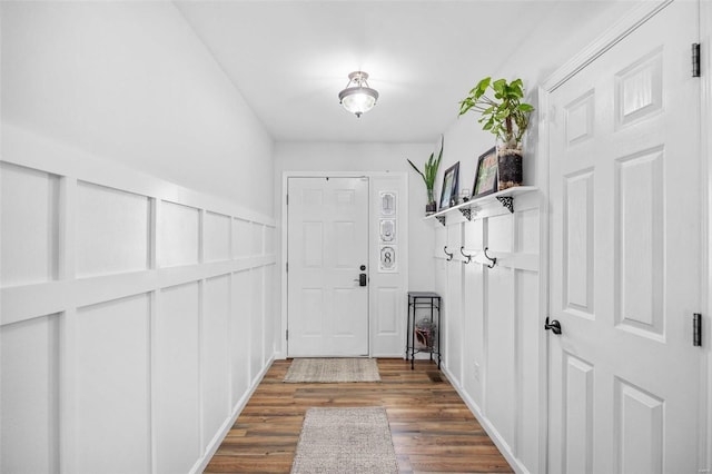 doorway with dark hardwood / wood-style floors