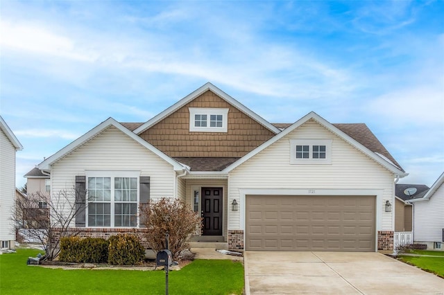 view of front of home featuring a garage and a front yard