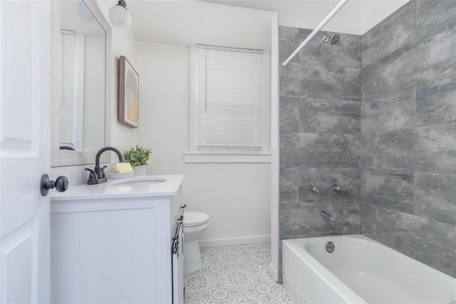 full bathroom featuring tiled shower / bath combo, vanity, toilet, and tile patterned flooring