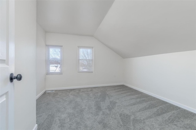 bonus room featuring carpet floors and lofted ceiling