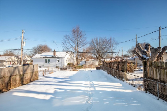 view of yard layered in snow