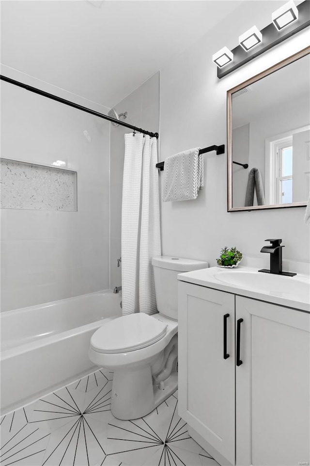 full bathroom featuring toilet, shower / tub combo with curtain, and vanity