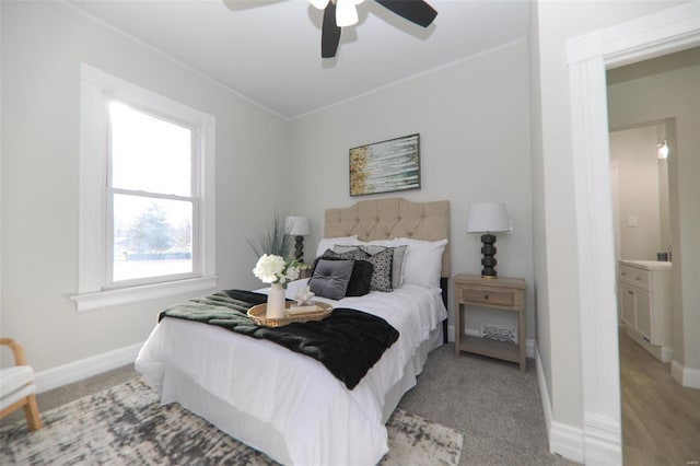 bedroom featuring light colored carpet and ceiling fan