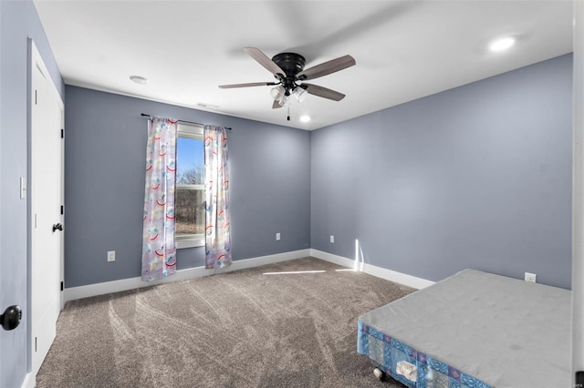 unfurnished bedroom featuring carpet and ceiling fan