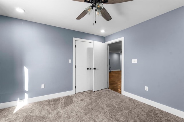 unfurnished bedroom featuring a closet, ceiling fan, and carpet