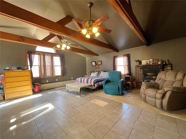 tiled bedroom featuring multiple windows, lofted ceiling with beams, and ceiling fan