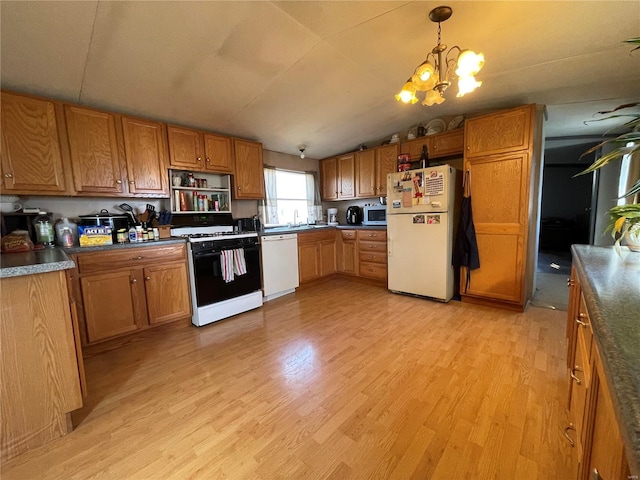 kitchen featuring white appliances, light hardwood / wood-style flooring, vaulted ceiling, and hanging light fixtures