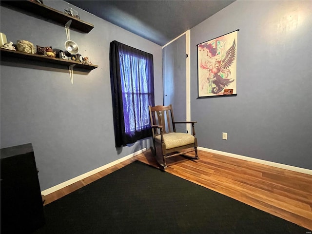 unfurnished room with hardwood / wood-style floors