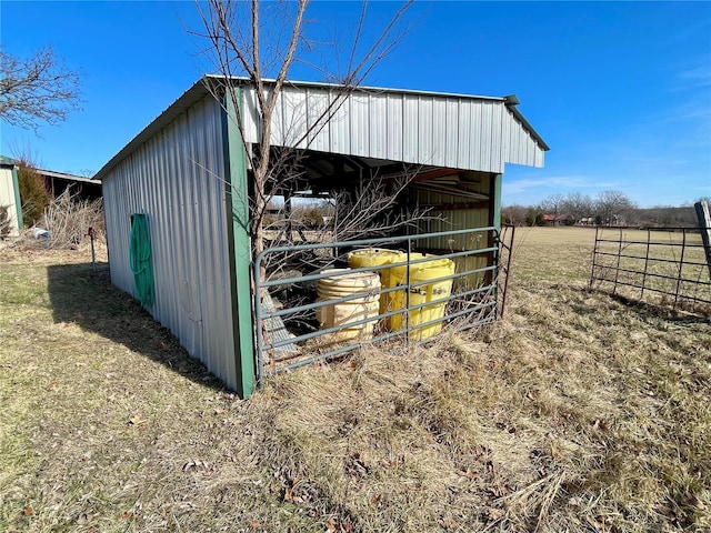 view of outbuilding featuring a rural view