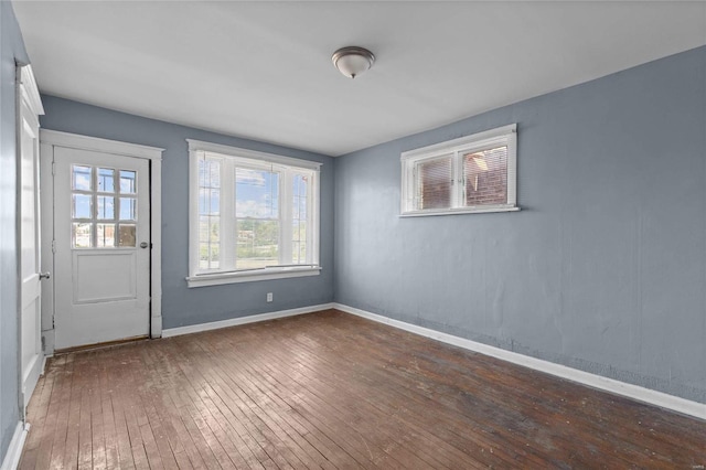 unfurnished room featuring dark wood-type flooring