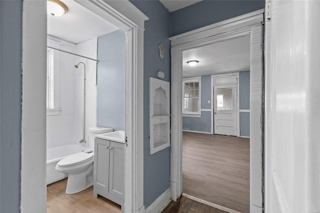 full bathroom with vanity, wood-type flooring, toilet, and shower / bath combination