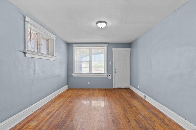 empty room with dark wood-type flooring