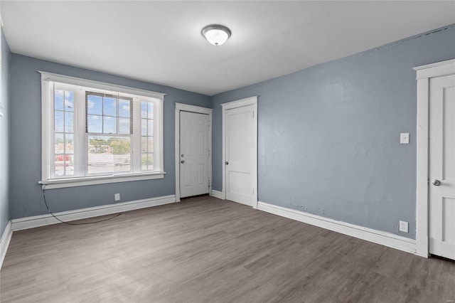 unfurnished bedroom with wood-type flooring