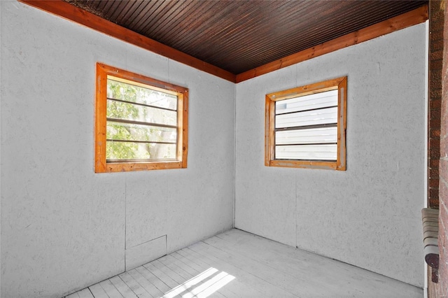 unfurnished room featuring wood ceiling