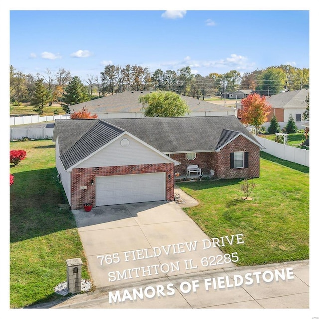 view of front of home with a garage and a front yard