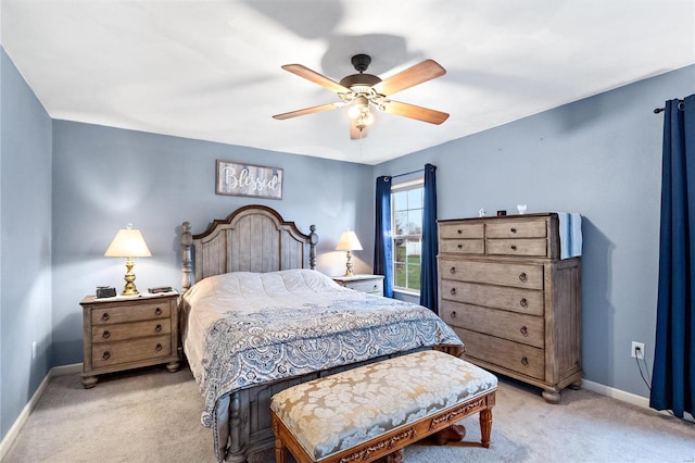 bedroom featuring ceiling fan and light carpet