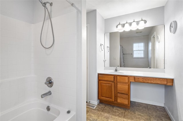 bathroom with washtub / shower combination and vanity