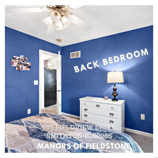 bedroom featuring visible vents, baseboards, ceiling fan, and freestanding refrigerator