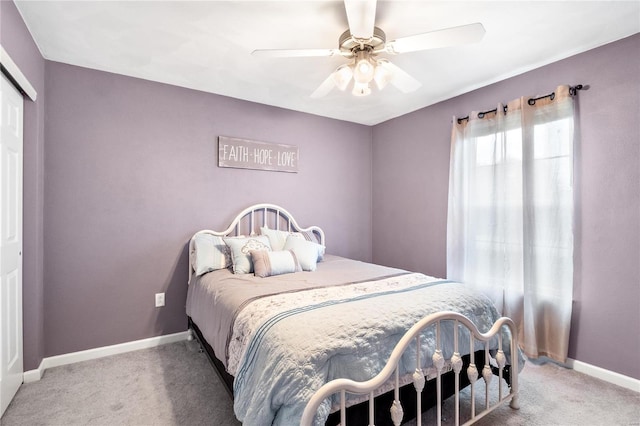 bedroom featuring a closet, baseboards, and carpet