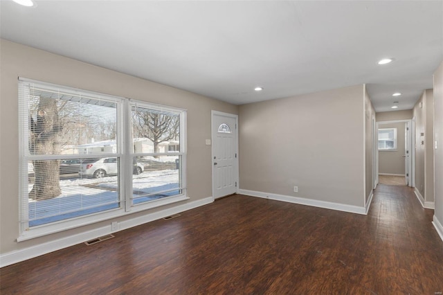 foyer entrance featuring dark hardwood / wood-style floors