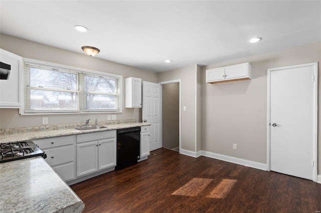 kitchen with sink, white cabinets, and dishwasher