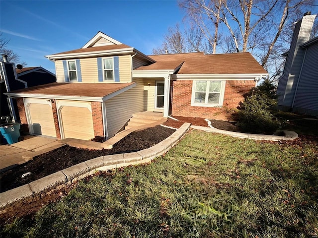 tri-level home with a garage and a front yard