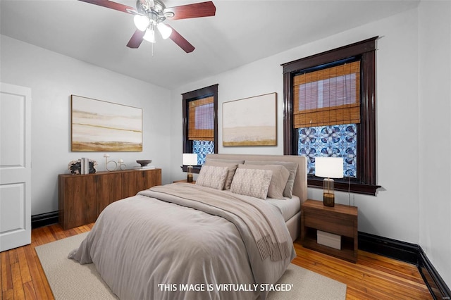 bedroom featuring ceiling fan and light wood-type flooring